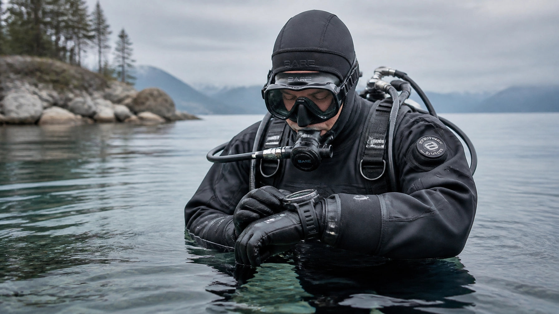 Diver in trilaminate drysuit preparing for a cold water dive